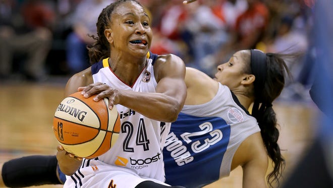 Indiana Fever forward Tamika Catchings (24) steals the ball from Minnesota Lynx forward Maya Moore (23) in the second half of their game. The Indiana Fever play the Minnesota Lynx in Game #4 of the WNBA Finals Sunday, October 11, 2015, evening at Bankers Life Fieldhouse.