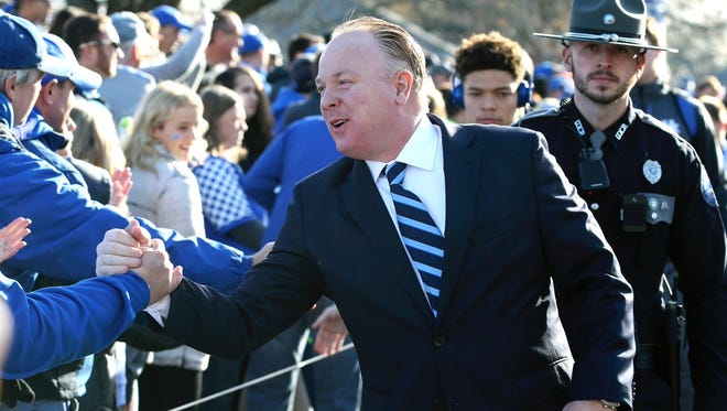 Kentucky coach Mark Stoops greets fans prior to his team's game against Louisville. Nov. 25, 2017