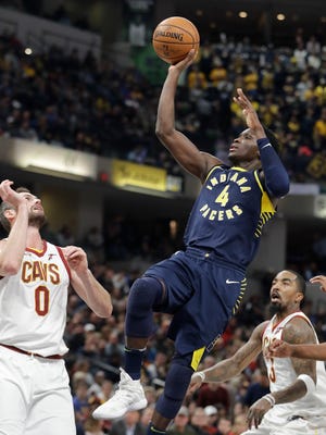Indiana Pacers' Victor Oladipo (4) shoots in front of Cleveland Cavaliers' Kevin Love during the second half of an NBA basketball game Friday, Dec. 8, 2017, in Indianapolis. The Pacers won 106-102. (AP Photo/Darron Cummings)