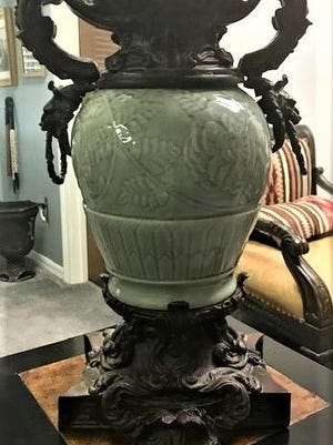 This mounted porcelain vase could be 100 years old.