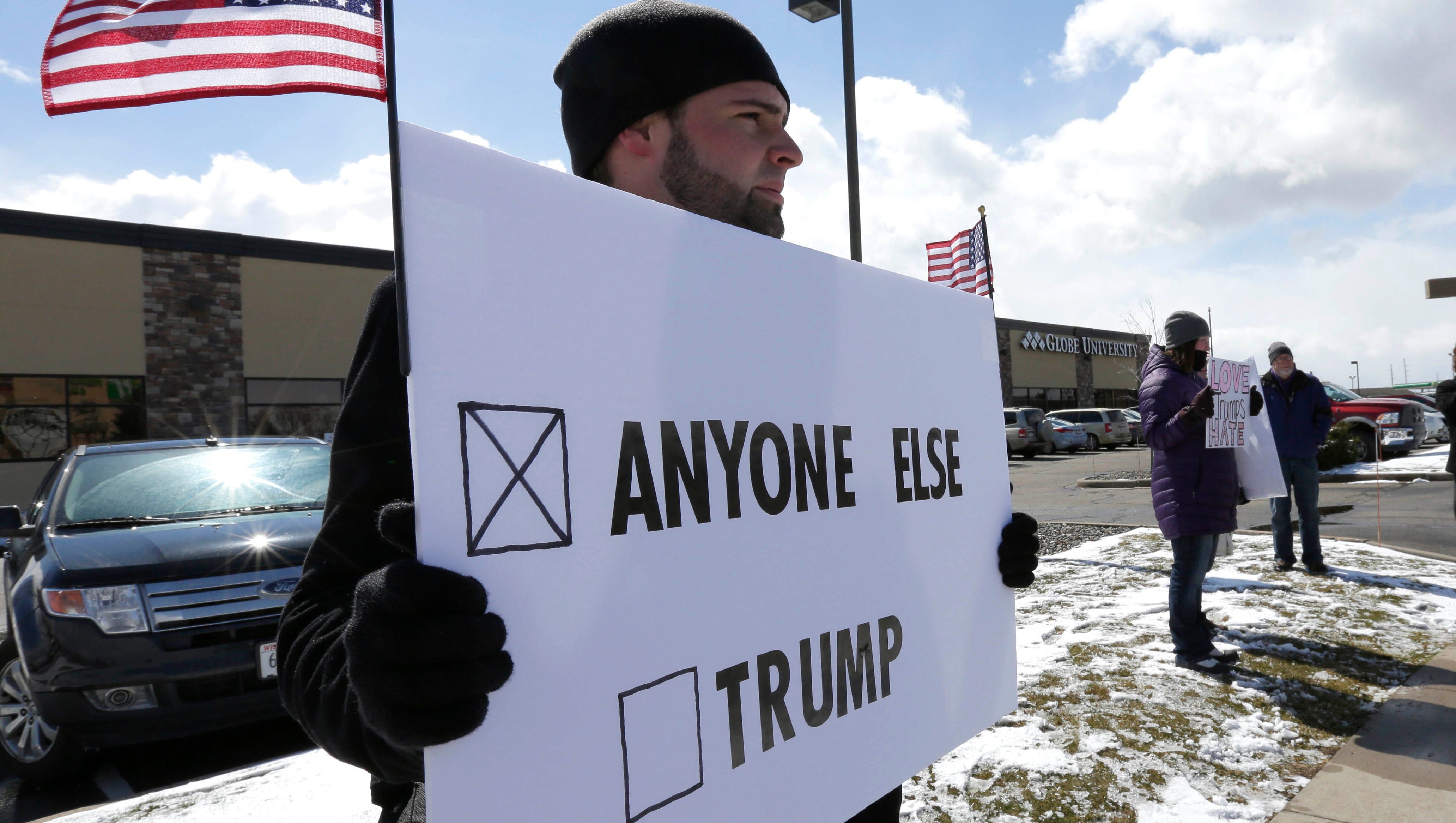 Supporters, protesters greet Trump in Rothschild