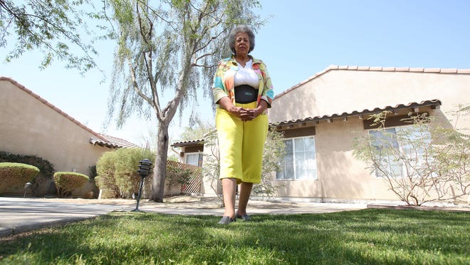 Lynne Joy Rogers in April 2015. Rogers told The Desert Sun that she believes her community could do more to help conserve water including removing this small patch of grass near her residence in La Quinta.