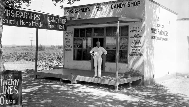 Hazel Barner's Lower Valley candy shop. Her husband, Eggert Barner, is pictured in front of the store.