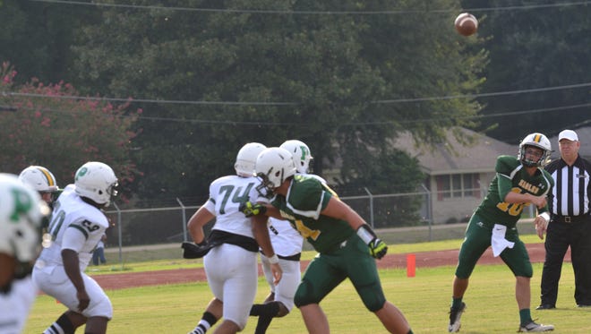 Menard quarterback John Roy launches a pass in the first game of the Cenla Jamboree Friday, Aug. 26, at Alexandria Senior High.