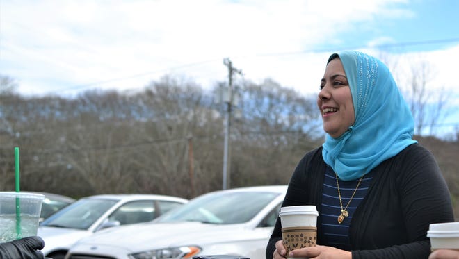 Kamelia Dardouk, 40, sits outside the Islamic Society of Clemson to chat with friends on Sunday afternoon.
