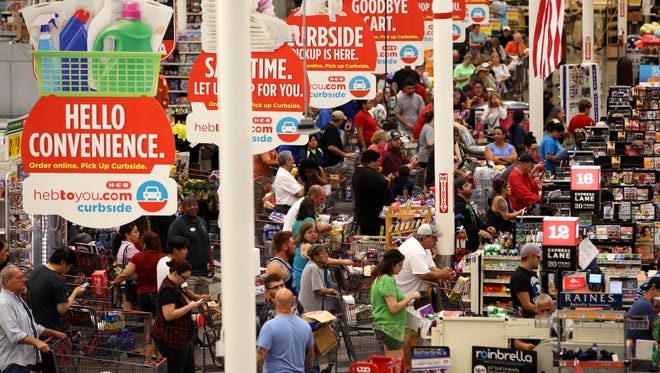 Shoppers look for last-minute supplies at H-E-B Plus on Saratoga Boulevard in Corpus Christi just minutes before it closes as Hurricane Harvey nears the coast in this 2017 file photo.