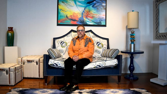 Michael Uvanni of Rome, N.Y., sits in one of his two interior design business showrooms in April 2017. Uvanni said his brother may have gotten more time from the many drugs he tried during his illness but that his quality of life was not good.