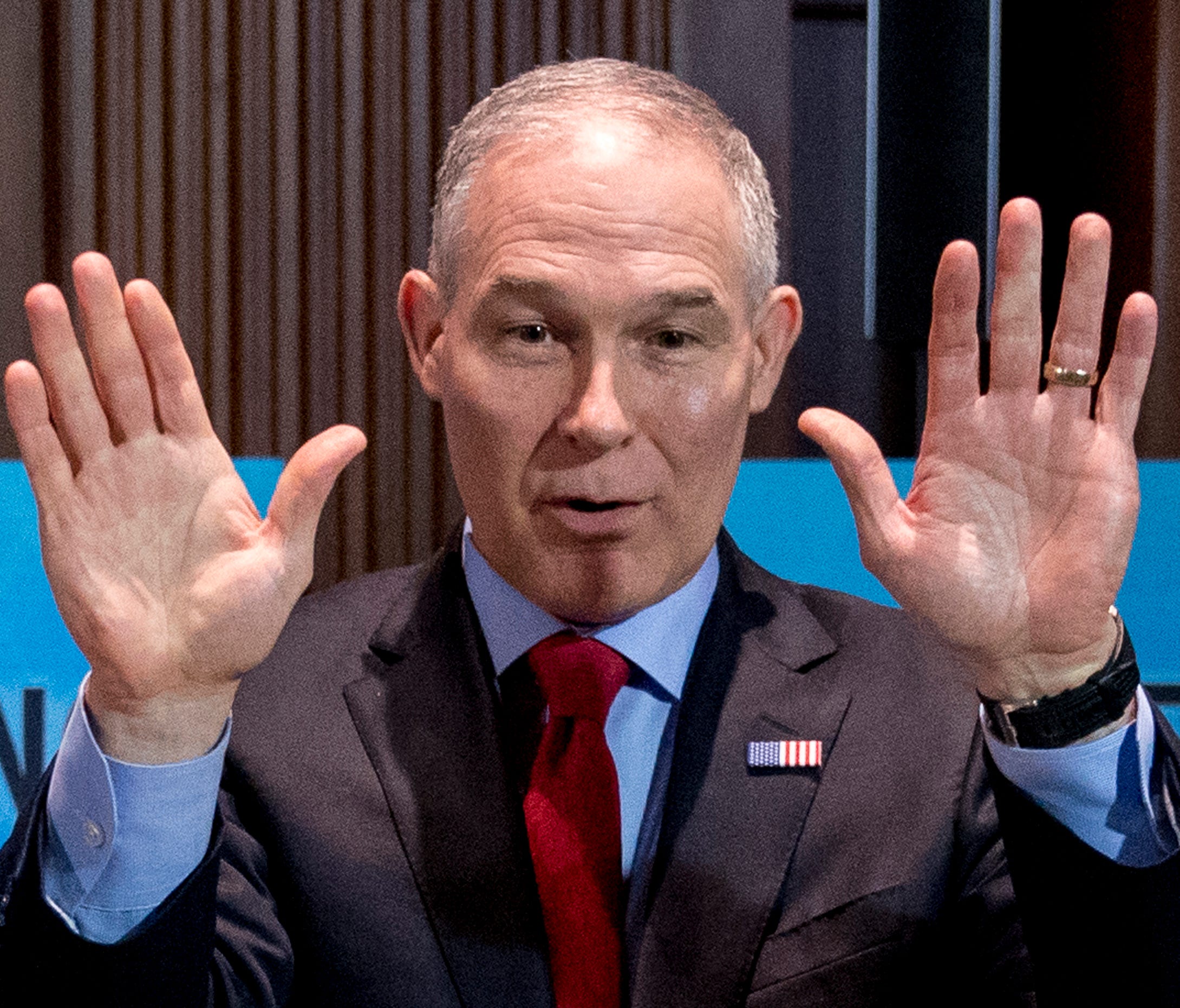 Environmental Protection Agency Administrator Scott Pruitt waves to members of the audience as he arrives for a news conference at the Environmental Protection Agency in Washington, April 3, 2018.