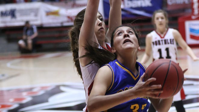 Bloomfield's Destiny Walther sizes up a shot against Portales' Lindsay Blakey during their 4A quarterfinal game on March 8 at The Pit in Albuquerque.