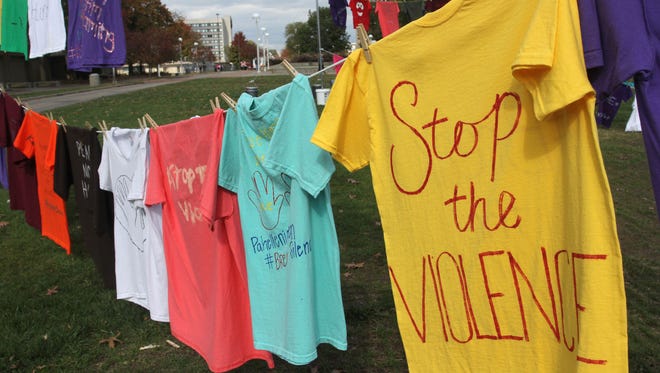 T-shirts adorn the Missouri State University campus as part of the Clothesline Project, a nationwide campaign to raise awareness for domestic violence.