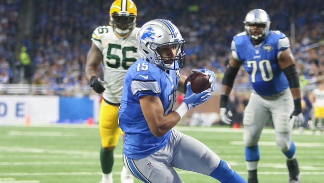 Lions  receiver Golden Tate catches a touchdown pass against the Packers during the second quarter Sunday, Jan. 1, 2017 at Ford Field.