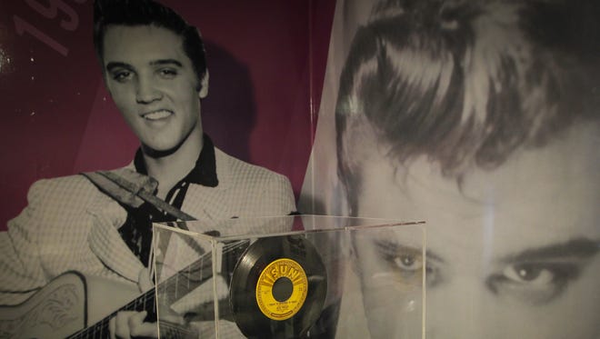 A 45 rpm record of, "I forgot to remember to forget," is one of the items in a new "60 years of Elvis" exhibit sits inside an annex at Graceland on Friday, Feb. 21, 2014, in Memphis, Tenn. The exhibit features jump suits worn by Presley, an organ played in his California home, a copy of the original Thats All Right record and other miscellaneous Elvis items. (AP Photo/Lance Murphey)