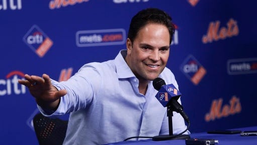 FILE - In this July 30, 2016, file photo, baseball Hall of Famer Mike Piazza speaks before a baseball game between the Mets and the Colorado Rockies in New York. Nelly promised on Twitter Feb. 28, 2017, to bring Piazza back to eat in the rapper’s hometown of St. Louis after Piazza spoke ill of the city’s restaurant scene.