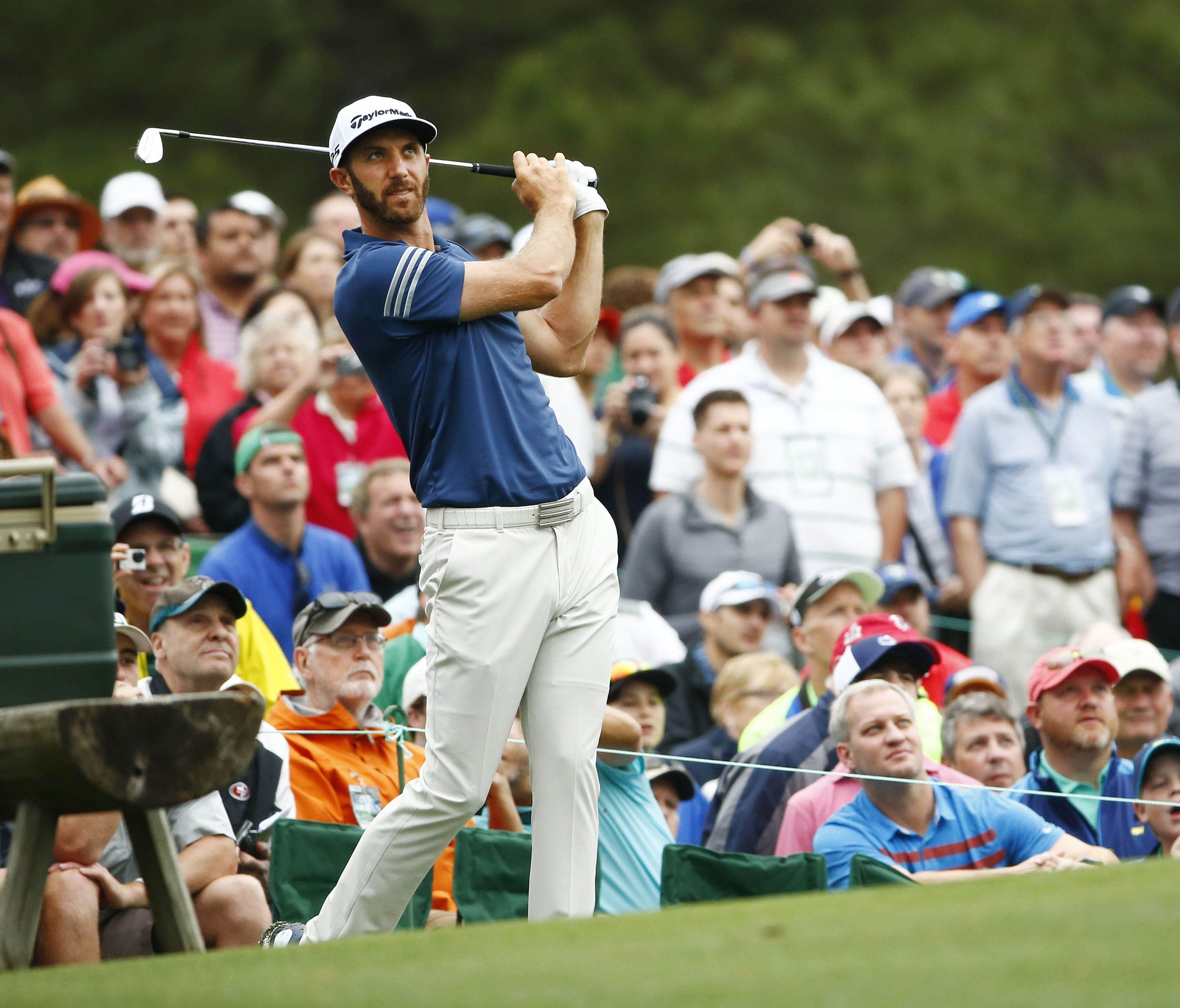 Dustin Johnson hits his tee shot on the 12th hole during a practice round at the Masters on April 4.