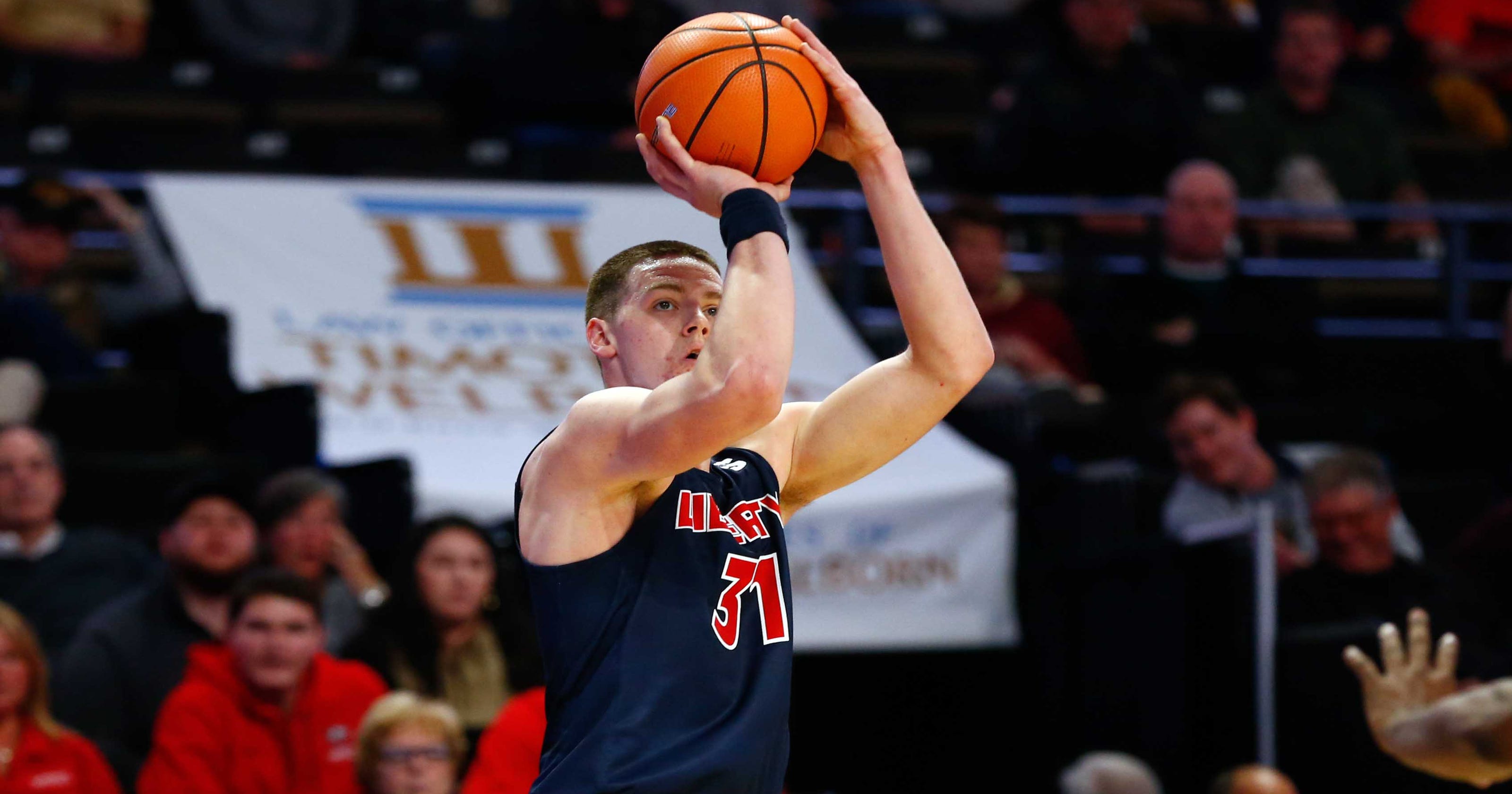 Liberty Stuns Unc Asheville Team In Big South Basketball Tournament