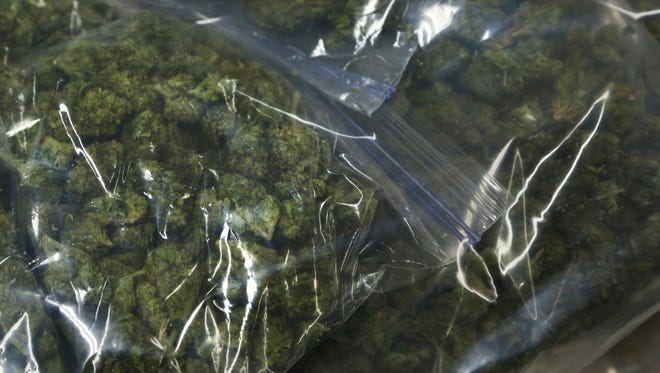 Bags of marijuana confiscated recently by Lafayette Police Department are displayed at police headquarters Wednesday, March 16, 2016, in Lafayette. Lt. Brian Gossard said there have been 189 drug arrests in Lafayette so far this year. "We want to attack the problem at the source, and that's drug use and drug dealing," said Gossard.