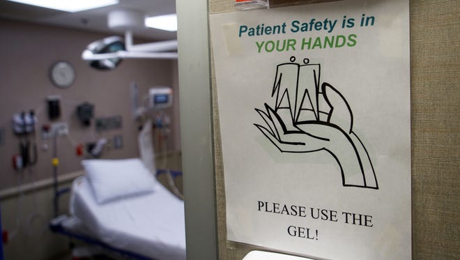 Hand sanitizing is encouraged all over the emergency room at St. Francis Hospital to prevent the spread of the flu virus.