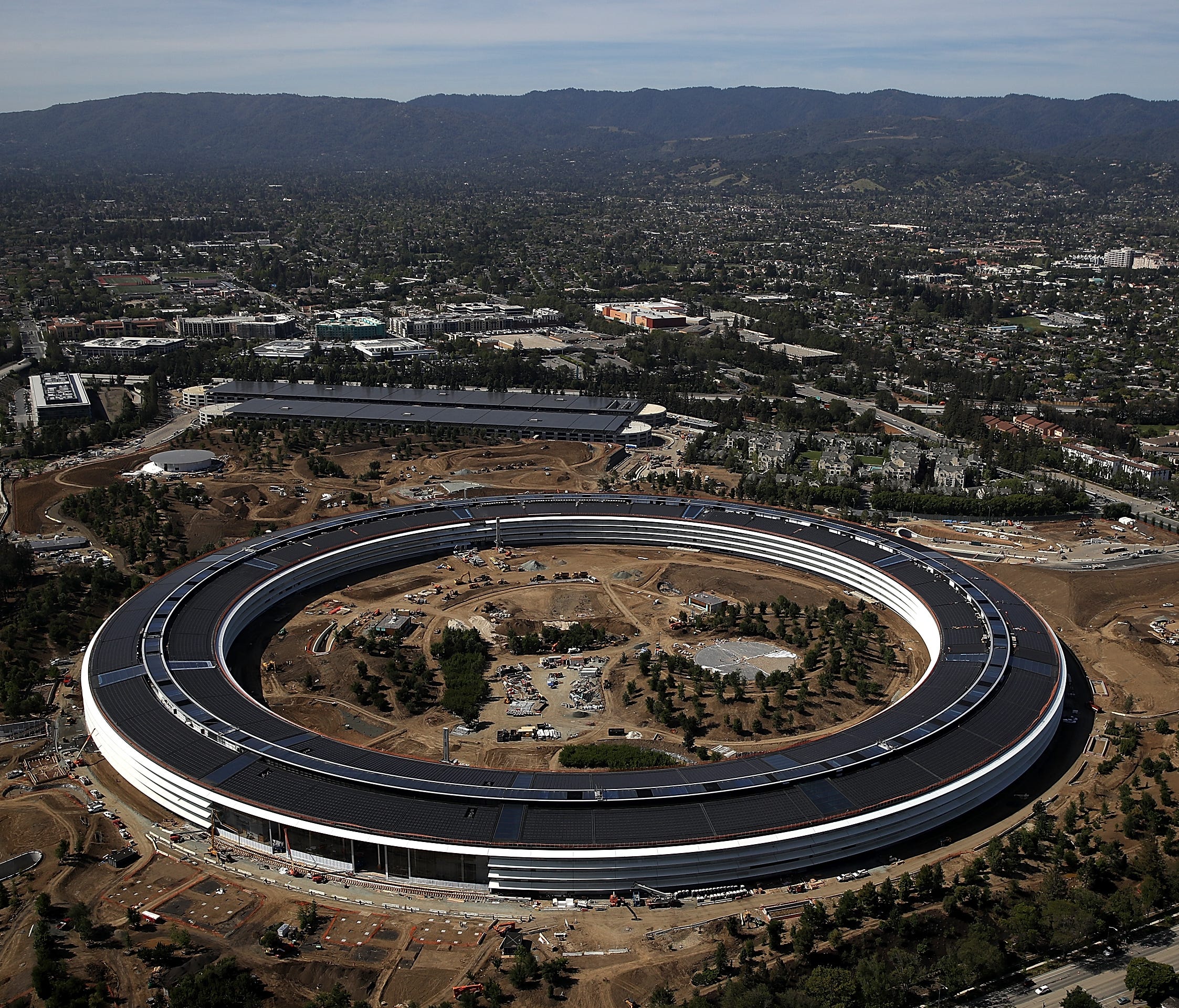 An aerial view of the new Apple headquarters on April 28, 2017 in Cupertino, California. Apple's new 175-acre 'spaceship' campus dubbed 'Apple Park' is nearing completion and is set to begin moving in Apple employees. The new headquarters, designed b