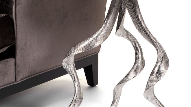 Heavy aluminum is cast into antler shapes to form the legs of an intriguing and sophisticated side table from 
Z Gallerie.