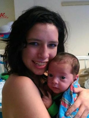 
Desiree Bragg, 19, holds her infant son, Tristan Castro, in a photo submitted by Bragg's mother, Wrenetta Nadon.

