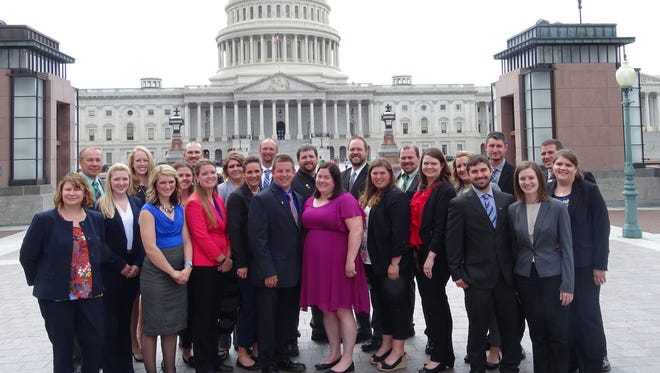 The group of YFA members posed for a photo in front of the Capitol after visiting with elected officials.