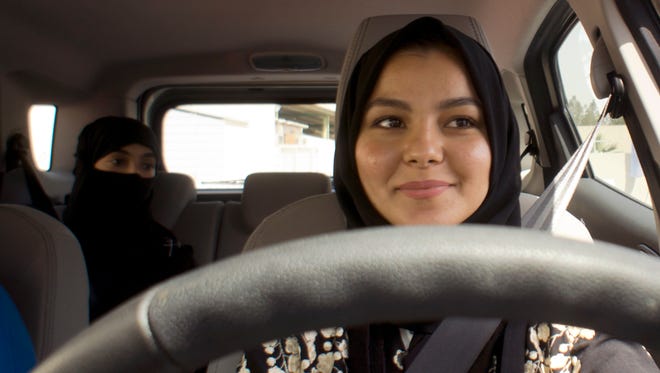 A student at the female-only campus of Effat University, sits for the first time in the driver's seat, during training sponsored by Ford Motor, in Jiddah, Saudi Arabia, on March 6, 2018.