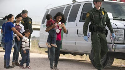 Illegal migrants are picked up in Texas in June.