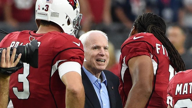 GLENDALE, AZ - SEPTEMBER 11:  Wide receiver Larry Fitzgerald #11 and Carson Palmer #3 of the Arizona Cardinals shakes hands with United States Senator John McCain prior to the coin flip before the start of a game against the New England Patriots at University of Phoenix Stadium on September 11, 2016 in Glendale, Arizona.  (Photo by Norm Hall/Getty Images)