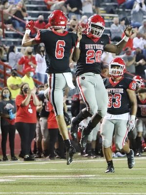 After scoring a touchdown against Little Rock Catholic in the first quarter, Walker Catsavis and Derius Wise celebrate, Friday, Oct. 9, at Mayo-Thompson Stadium.