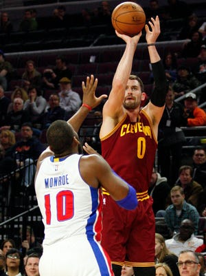 Cleveland Cavaliers forward Kevin Love (0) takes a shot over Detroit Pistons forward Greg Monroe (10) during the second quarter at The Palace of Auburn Hills.