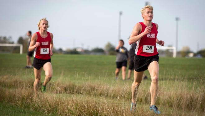 Wapahani brothers Nathan and Alex Herbst take the lead during the IHSAA Sectional Oct.7 at the Muncie Sportsplex. Muncie Central won the sectional for the boys and Delta won the sectional for the girls.