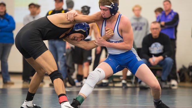 Brody Lamb of Poudre goes head to head with Mountain Range wrestler Andrew Melendez during the Front Range League Tournament on Saturday, January 28, 2017. 