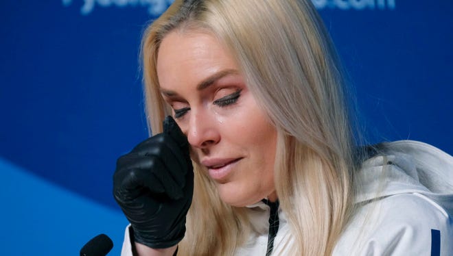 Lindsey Vonn wipes away a tear after answering a question about her grandfather during a news conference ahead of the Olympics in Pyeongchang, South Korea in early February.