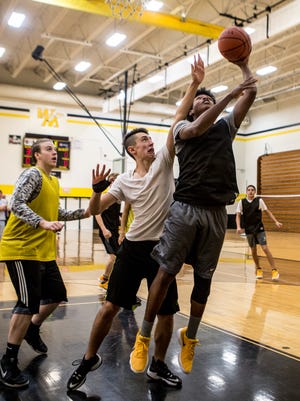 The Watkins basketball team runs drills to get ready for the start of their new season.