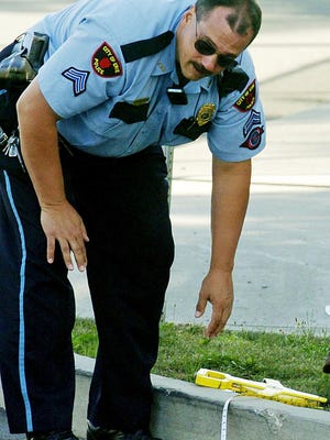 This is an August 2006 file photo of then-Cpl. Jeff Annunziata of the Erie Bureau of Police, on the scene of a traffic accident on Erie's east side.