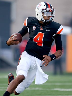 Oregon State quarterback Seth Collins (4) scrambles against Weber State during the first half at Reser Stadium, Friday, September 4, 2015, in Corvallis, Ore. The Beavers won the game 26-7.