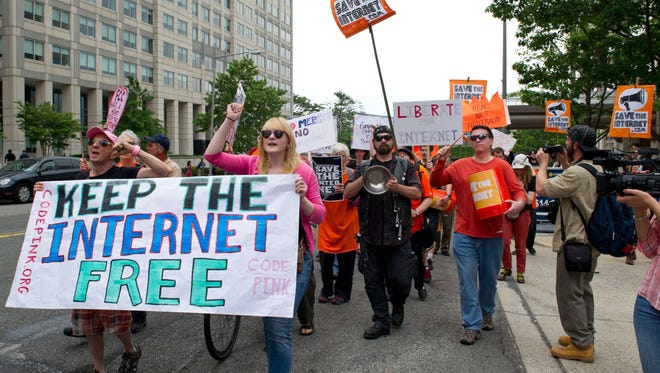 Protesters hold a rally to support "net neutrality" outside the Federal Communications Commission on May 15, 2014.