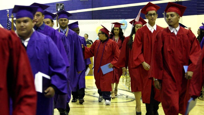 Graduates exit the Salinas Union High School District's Summer Commencement Ceremony on Friday.