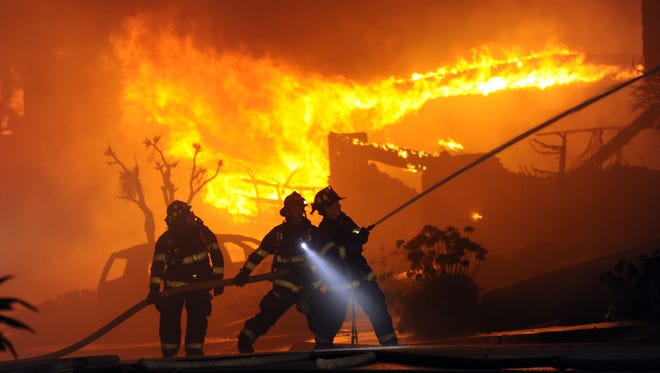 Firefighters battle a fire from a high-pressure gas line explosion in San Bruno, Calif., in 2010.