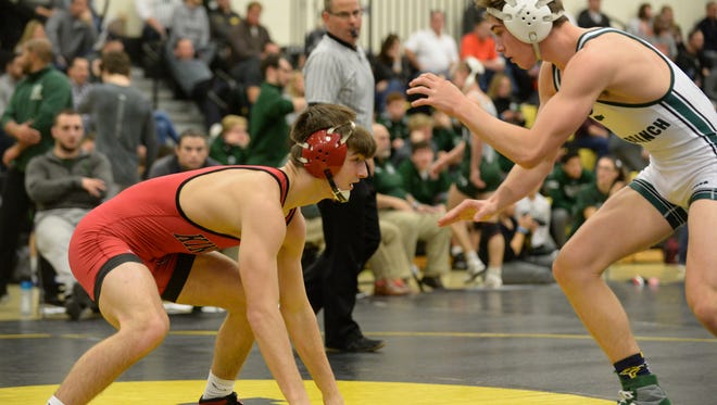Kingsway's Quinn Kinner looks to make a move against  Long Branch's Ryan Carey in a 138-pound bout during Satuday's Jack Welch Duals at Moorestown High School. Kinner's Dragons will see stiff competition this week.