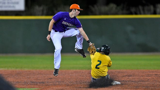 Northwestern State's David Fry p uts the tag on a Sacramento State baserunner during Wednesday's game.