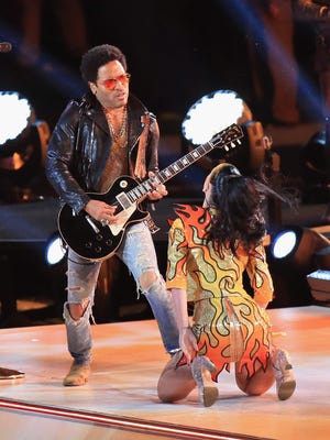 Lenny Kravitz performs with Katy Perry during the Pepsi Super Bowl XLIX Halftime Show at University of Phoenix Stadium on February 1, 2015 in Glendale, Arizona.