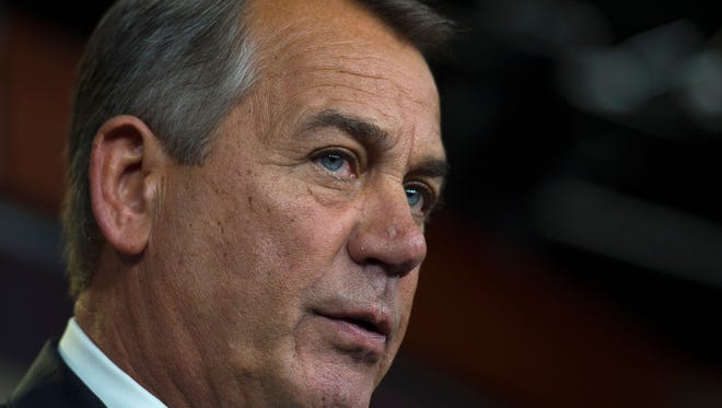 House Speaker John Boehner listens during a news conference on Capitol Hill Thursday. Boehner refused to rule out a potential shutdown at the Department of Homeland Security because of a congressional impasse over funding.