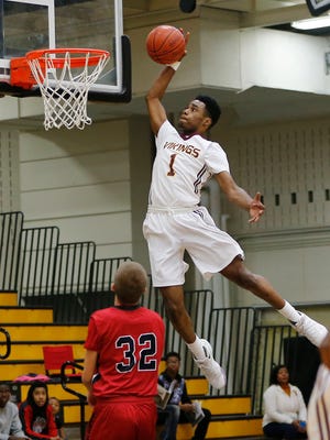 Milwaukee Vincent's  Andrew Lewis throws down a slam dunk against Pewaukee.