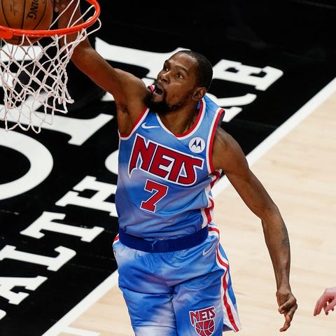 Brooklyn Nets forward Kevin Durant scores in overt