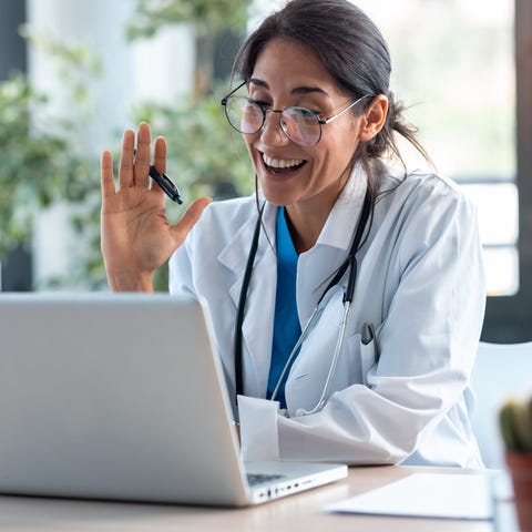 Happy doctor on a telehealth call.