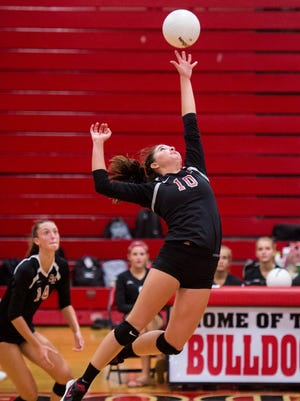 South Fork's Skylyr Magliochetti swipes just underneath the ball as teammate Angela Grieve (left) backs her up during the first game of the high school volleyball match Wednesday, Aug. 23, 2017, against Jupiter at South Fork High School in Tropical Farms.