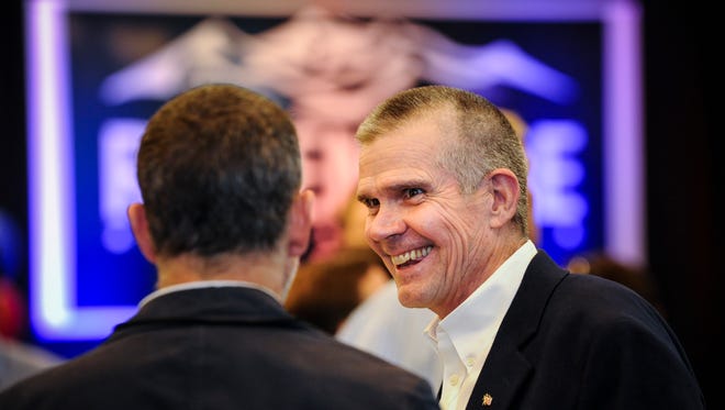 Matt Rosendale, a candidate for the Republican nomination for U.S. Senate, speaks with a supporter Tuesday in Helena.