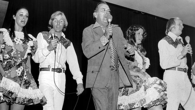 Tennessee Ernie Ford (center) and his Nashville-Opryland touring troupe --- also dubbed the "Moscow-Nashville Express" after a recent goodwill tour of the Soviet Union --- launched the 19th annual Holiday Inn World Conference at Holiday Inn-Rivermont on Oct. 20, 1974. Several hundred Holiday Inn officials and franchise owners from 43 countries and territories attended the show.