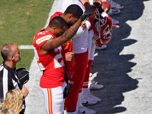 Kansas City Chiefs cornerback Marcus Peters raises